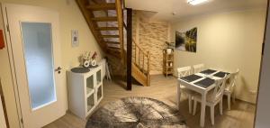 a room with a table and a dining room at Ferienhaus Am Trollmönch in Goslar +18 photos