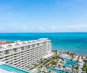 an aerial view of a hotel and the ocean at Garza Blanca Resort & Spa Cancun in Canc&uacute;n