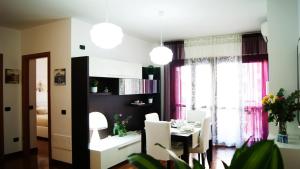 a kitchen and dining room with a table and chairs at Catia Sweet Holiday 2 in Fiumicino