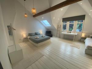 a bedroom with a bed and a sink in it at Old Town Suites in Malmedy