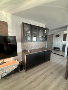 a large living room with a large flat screen tv at Apartament Relax in Gdańsk