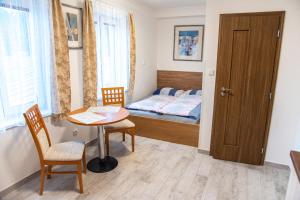 Tempat tidur dalam kamar di Panská