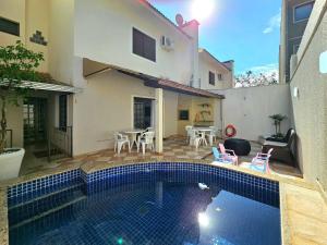 Foto de No Centro 9 pessoas com Piscina e Churrasqueira