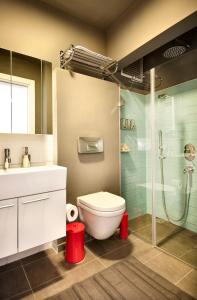 a bathroom with a toilet sink and a shower at Nuru Ziya Residences in Istanbul