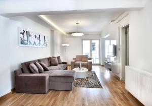 a living room with a couch and a table at Nuru Ziya Residences in Istanbul