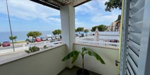 a window with a view of the ocean at Apartments Stella in Piran