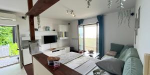 a living room with a couch and a table at Apartments Stella in Piran
