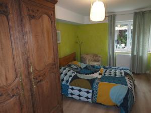 Postel nebo postele na pokoji v ubytování colmar entier