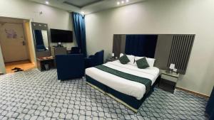 Ένα ή περισσότερα κρεβάτια σε δωμάτιο στο Quel Serviced Units
