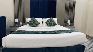 Ένα ή περισσότερα κρεβάτια σε δωμάτιο στο Quel Serviced Units