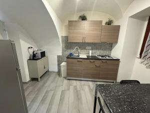 a kitchen with a sink and a counter top at Meghan Home in Catania