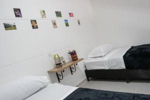 Postel nebo postele na pokoji v ubytování Laureles Garden Hostel + 37 fotografií
