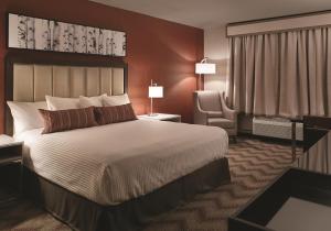 Ένα ή περισσότερα κρεβάτια σε δωμάτιο στο Oxford Casino Hotel