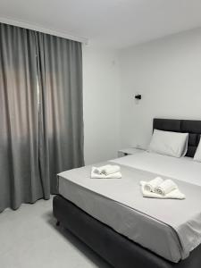 A bed or beds in a room at Apartments MASIMO