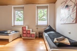 Φωτογραφία από το άλμπουμ του Wohnung Nähe Mainz in ehemaligem Weingut mit 6 Schlafzimmer σε Rommersheim