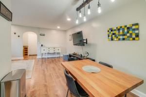 a room with a wooden table and a desk at Convenient Arlington Condo about 4 Mi to National Mall in Arlington +16 photos