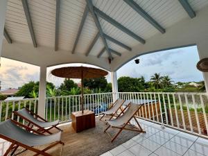 Balkón nebo terasa v ubytování Ti-Coco Lodge - Calme Spacieux Vue Nature Proche Commerces Plages