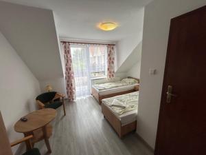 Postel nebo postele na pokoji v ubytování Veno- Niechorze