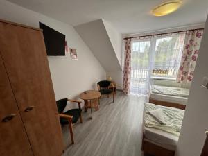 Postel nebo postele na pokoji v ubytování Veno- Niechorze