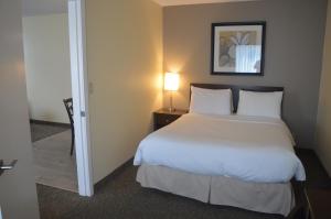 Postel nebo postele na pokoji v ubytování Siesta Suites