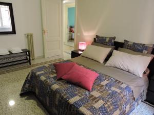 Кровать или кровати в номере La Gioiosa B&B