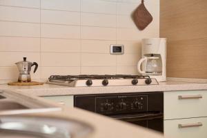 Kuchyň nebo kuchyňský kout v ubytování Bella Villa Apartments