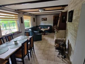 a living room with a table and a couch at holiday home in Kopice by Stepnica for 5 persons in Stepnica