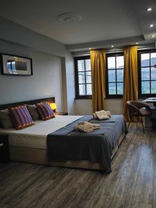 a bedroom with a large bed in a room at The Hill in Veliko Tŭrnovo