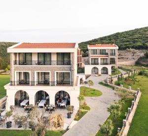 an aerial view of a building with tables and chairs at CAROLEA VILLAS in Ulcinj
