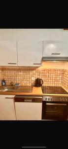 Kuchyň nebo kuchyňský kout v ubytování Le Spacieux en vieille ville + 5 fotografií