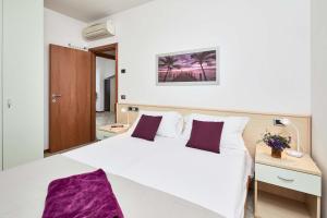 Postel nebo postele na pokoji v ubytování Bella Villa Apartments