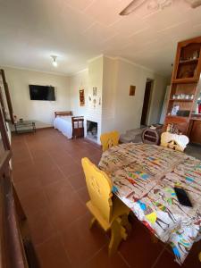 a bedroom with a bed and a living room at Casa Cadillal in El Cadillal