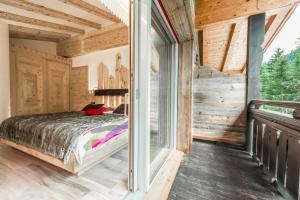 Chalet Pineta relax location客房内的一张或多张床位