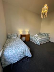 Letto o letti in una camera di Low Cost Accommodation