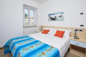 Postel nebo postele na pokoji v ubytování Bella Villa Apartments