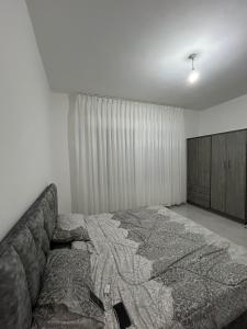 a bedroom with a large bed and a couch at Magic View ماجيك فيو in Al Salt +80 photos
