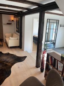 a living room with a couch and a table at New Stylish Apartment Downtown in Klaksvík