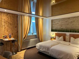 Postel nebo postele na pokoji v ubytování tauwerk Hotel