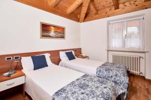 Postel nebo postele na pokoji v ubytování Bella Villa Apartments