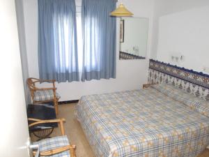 Postel nebo postele na pokoji v ubytování Apartamentos Montserrat
