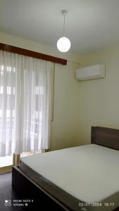 Postel nebo postele na pokoji v ubytování Lungomare Apartament