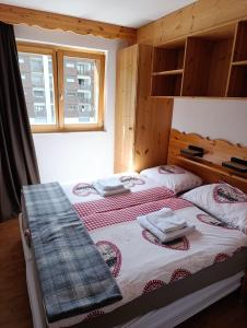 Postel nebo postele na pokoji v ubytování Appartement 3.5 Nendaz