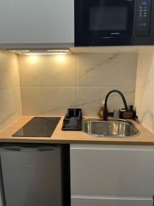 Kuchyň nebo kuchyňský kout v ubytování Charmant Studio aux portes de Paris + 3 fotografie