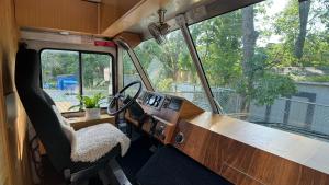 an interior view of the inside of an rv with a desk at City Hideaway, Off Grid Luxe in Lancaster