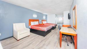 Postel nebo postele na pokoji v ubytování Executive Inn Hondo