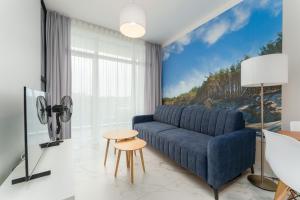 Μια τηλεόραση ή/και κέντρο ψυχαγωγίας στο Apartament Baltic Park IVA z Basenem Letnim by HolidaySun