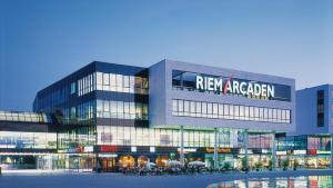 a large building with a new regeland sign on it at Top-Apartment a.d. Messe in Munich