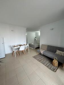 a living room with a couch and a table at Zen Apartment Tenerife in San Miguel de Abona +10 photos