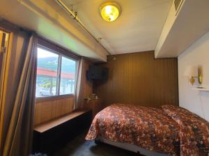 Postel nebo postele na pokoji v ubytování Keystone Hotel