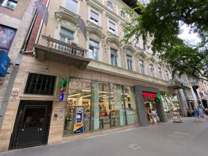 a store front of a building on a city street at Pink Rose Boutiques in Budapest